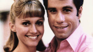 Grease John And Olivia Grainy Photograph Wallpaper