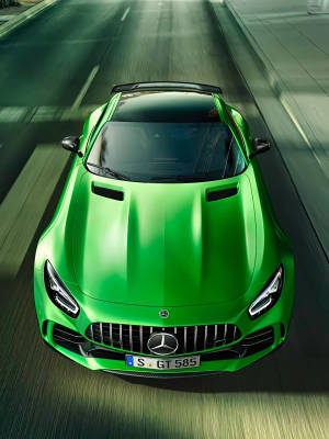 Green Amg Driving Down The Road Wallpaper