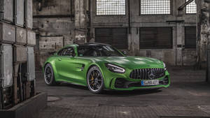 Green Amg Parked In Large Garage Wallpaper