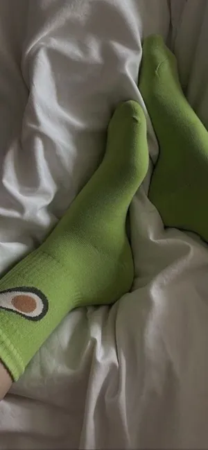 Green Avocado Socksin Bed Wallpaper