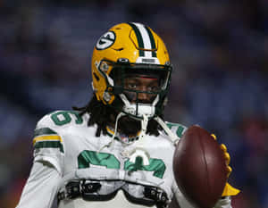Green Bay Defensive Player Holding Football Wallpaper