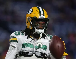 Green Bay Defensive Player Holding Football Wallpaper