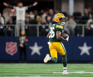 Green Bay Packers Player Running With Football Wallpaper