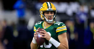 Green Bay Packers Quarterback Jordan Love Preparingto Pass Wallpaper