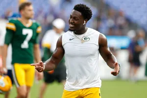 Green Bay Player Smiling During Warmup Wallpaper