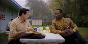 Green Book Movie Scene Outdoor Diner Conversation Wallpaper