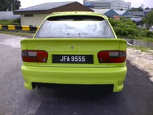 Green Proton Wira Rear View Wallpaper