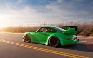 Green R W B Porsche Speedingon Highway Wallpaper