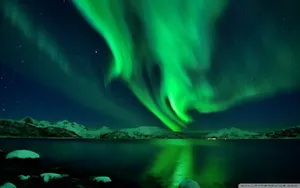 Green Sky Over Snow Mountains Wallpaper