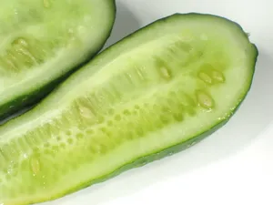 Green Sliced Cucumber With Seeds Wallpaper
