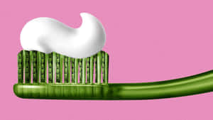 Green Toothbrush With Toothpaste Wallpaper