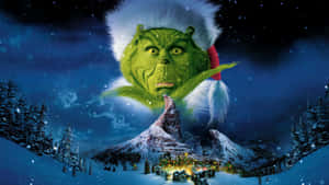 Grinch Overlooking Whoville Winter Scene Wallpaper