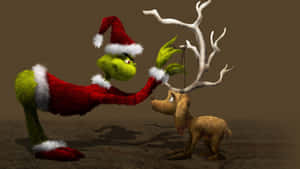 Grinch_ Placing_ Antler_on_ Dog Wallpaper