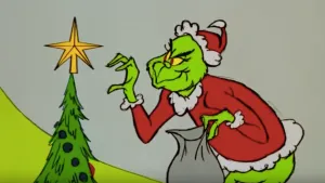 Grinch Plotting Christmas Mischief Wallpaper