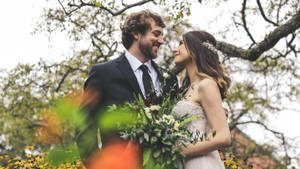 Groom And Bride With Bouquet Wallpaper