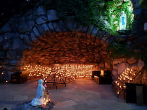 Grottoof Virgin Marywith Candles Wallpaper