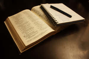 Group Bible Study Session With A Rustic Wooden Table And Books Wallpaper