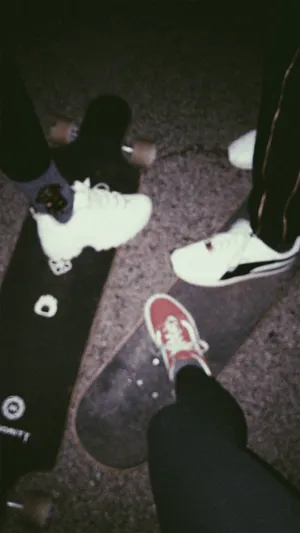 Grunge Skater Shoesand Skateboards Nighttime Wallpaper