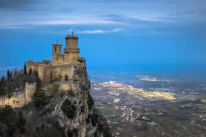 Guaita Tower Against Bright Blue Sky Wallpaper