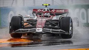 Guanyu Zhou Racing Through The Rain Wallpaper