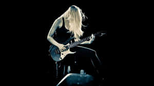 Guitarist Performancein Spotlight.jpg Wallpaper