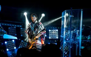 Guitarist Performing Live Concert Wallpaper