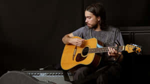 Guitarist Practicingin Studio Wallpaper
