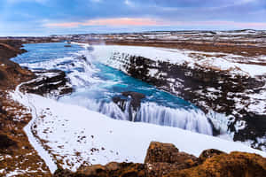 Gullfoss Waterfall With Perennial Snow In Southwest Iceland Wallpaper