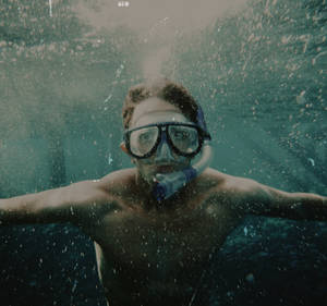 Guy Snorkeling Alone Wallpaper