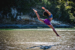 Gymnastics Jump In River Wallpaper