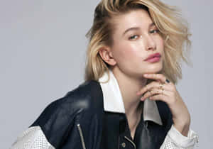 Hailey Baldwin Striking A Pose In An Elegant Evening Dress. Wallpaper