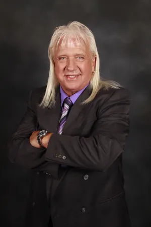 Hall Of Fame Wrestler Ricky Morton In Action Wallpaper