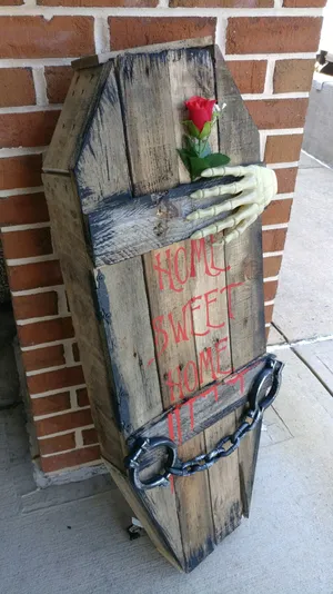 Halloween Coffin Decorationwith Roseand Hands Wallpaper