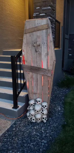 Halloween Coffin Decorationwith Skullsand Lights Wallpaper