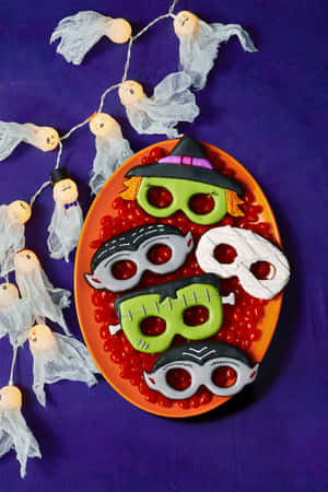 Halloween Mask Cookieson Orange Plate Wallpaper
