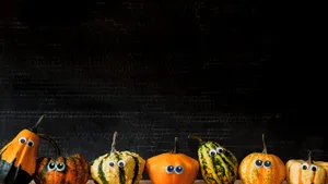 Halloween Pumpkinswith Googly Eyes Wallpaper