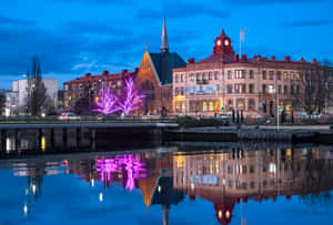 Halmstad Riverfront Evening Reflections Wallpaper