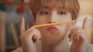 Han Stray Kids Playful Moment Wallpaper