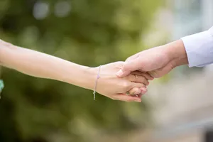 Hand In Hand Stretched Out Wallpaper