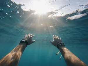 Hand Of A Resilient Person Underwater Wallpaper