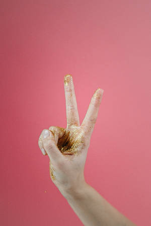 Hand Peace Symbol With Glitters Wallpaper