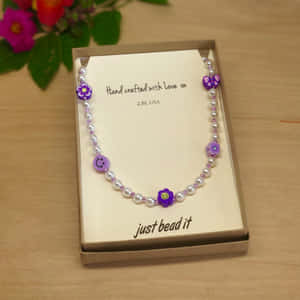 Handcrafted Purple Beaded Necklace Wallpaper