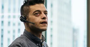 Handsome Rami Malek Wearing Headset Wallpaper