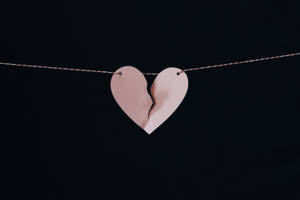 Hanging Pink Broken Heart Wallpaper