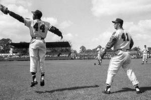 Hank Aaron Jumping On Field Wallpaper