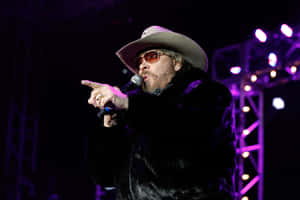 Hank Williams Jr Singing Live On The Grand Ole Opry Wallpaper