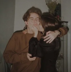 Happy Couple Enjoying A Cozy Embrace Wallpaper