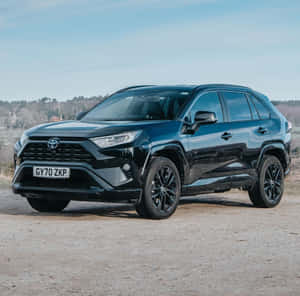 Happy Family Enjoying A Road Trip In Their Family Car Wallpaper