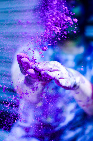 Happy Holi Hd Spreading Violet Powder Wallpaper