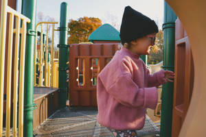 Happy Kid In Playground Wallpaper